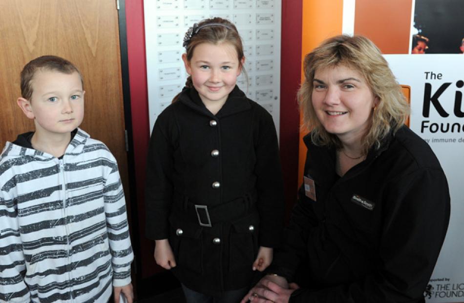 Callum (6) and Jorja MacKenzie (9), and volunteer Sue Herd.