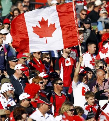Canada fans cheer before their Rugby World Cup Pool A match against Japan at McLean Park in...