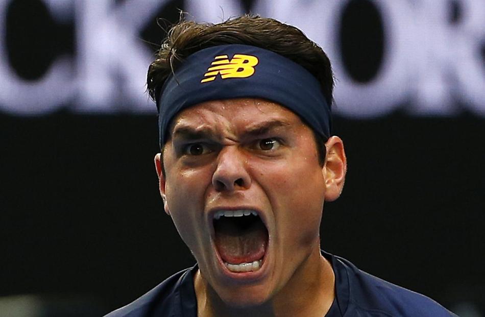Canada's Milos Raonic reacts after winning his fourth round match against Switzerland's Stan...