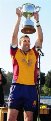 Captain Luke Herden holds up the Meads Cup after the 39-18 win over Wanganui in the 2010 final in...
