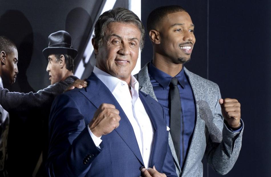 Cast members Sylvester Stallone (L) and Michael B. Jordan pose during the premiere of 'Creed'....