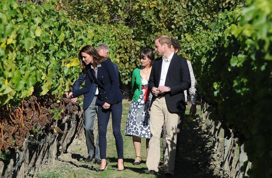 Catherine, the Duchess of Cambridge, and Prince William, the Duke of Cambridge, walk through the...