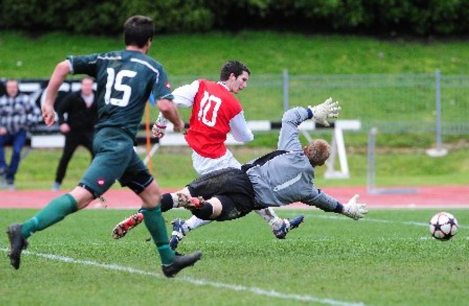 Caversham's Ant Hancock shoots past keeper Danny Robinson to force the Chatham Cup semifinal at...