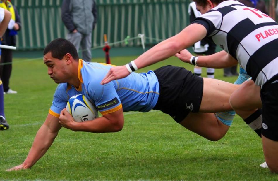Centre Faasiu Fuitai dives to score a try for University A against Southern.