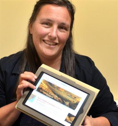 Centre for Science Communication lecturer Dr Jenny Rock tries out a new website on galaxiids,...