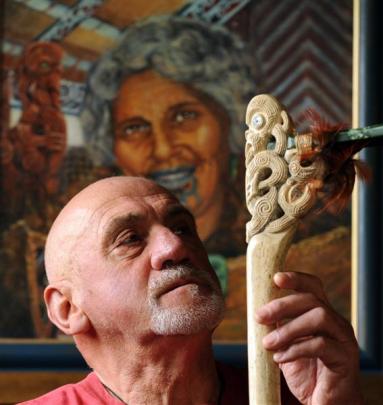 With his grandmother Huhana looking over his shoulder, Lou Armstrong studies a traditional Maori...