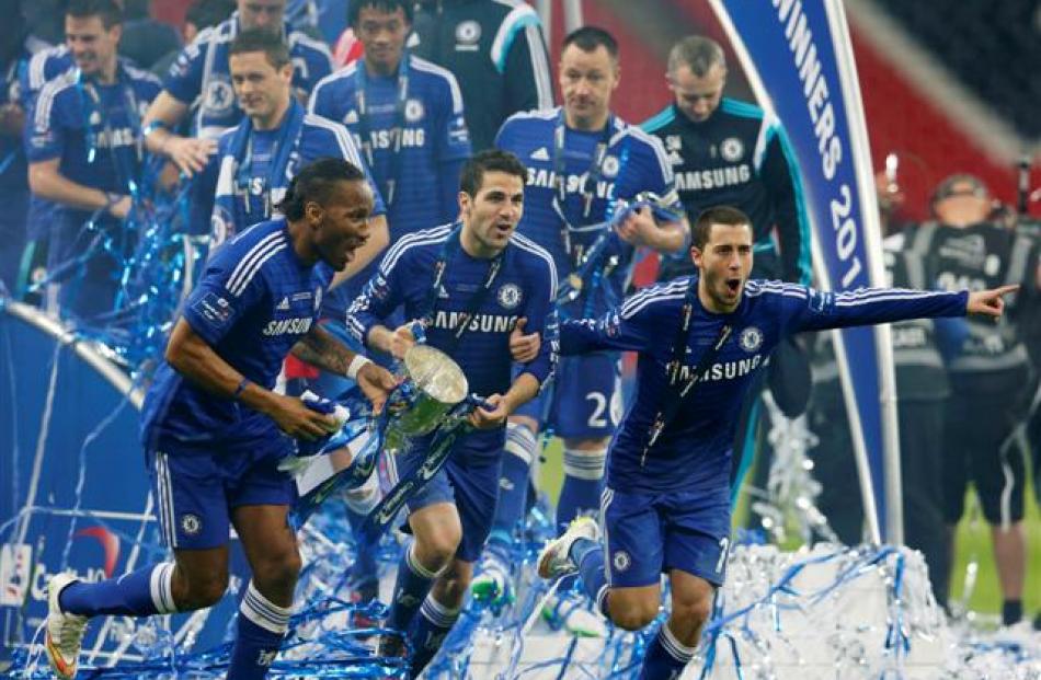 Chelsea players (l-r) Didier Drogba, Cesc Fabregas and Eden Hazard celebrate their team's League...