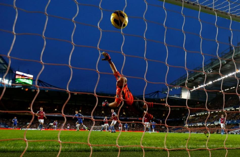 Chelsea's Fernando Torres (centre L) heads a goal past Aston Villa goalkeeper Brad Guzlan during...