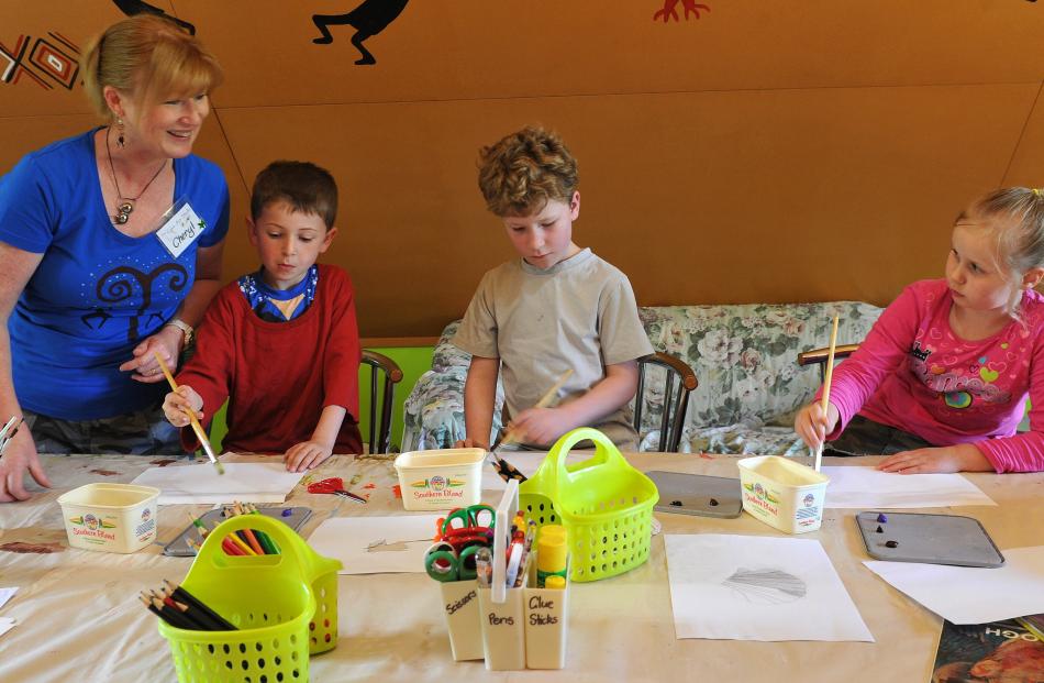 Cheryl Pearson takes an art class at The Cave Art Studio in East Taieri with (from left) William...