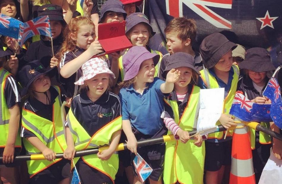 Children gather at Mosgiel Railway Station to greet Prince Charles and the Duchess of Cornwall....