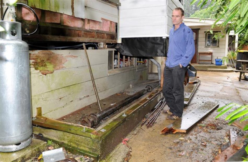 Chris Gable at the corner of his Malvern St home, which, it turns out, physically encroaches on a...