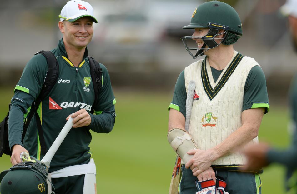 Chris Rogers with Australian captain Michael Clarke at a recent training session. Photo by Reuters.