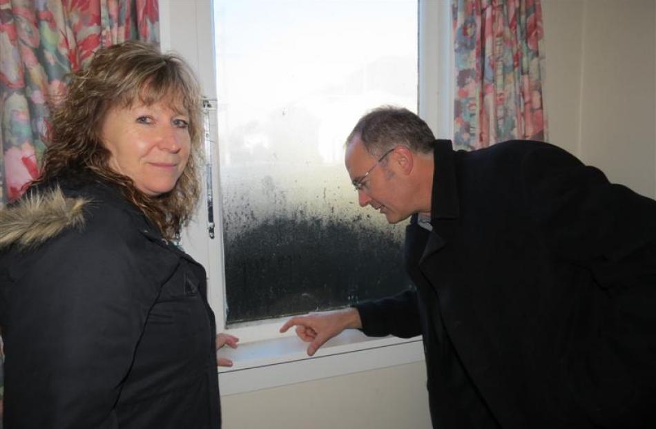 Clare Curran and Phil Twyford take a closer look at  mould on windows in Karyn and Graeme...