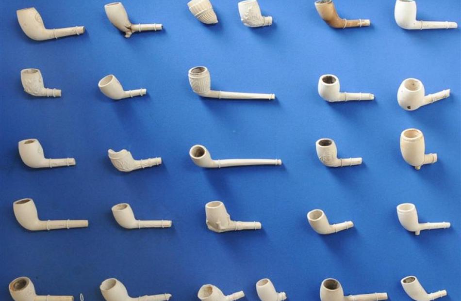 Clay pipes adorn a wall inside Peter Marsh's home.
