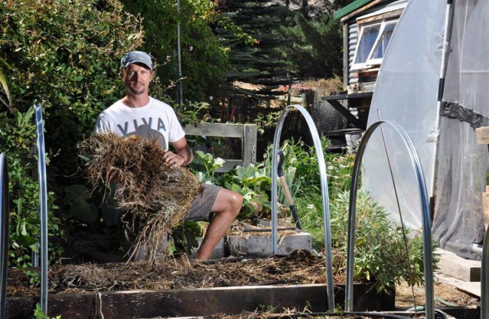Cloche hoops and tunnel houses create a milder micro-climate for vegetables through the winter.