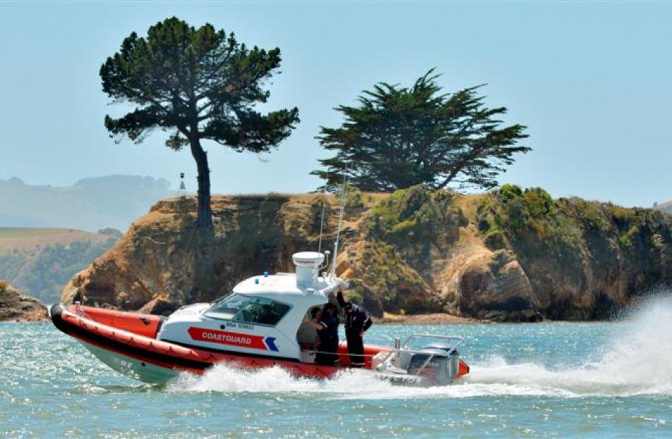 Coastguard Dunedin crew test their new vessel, enjoying the extra horsepower, on Otago Harbour...