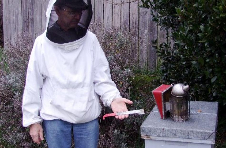 Colin Fitzpatrick models a veil, although he does not usually wear one, and displays a smoker and...