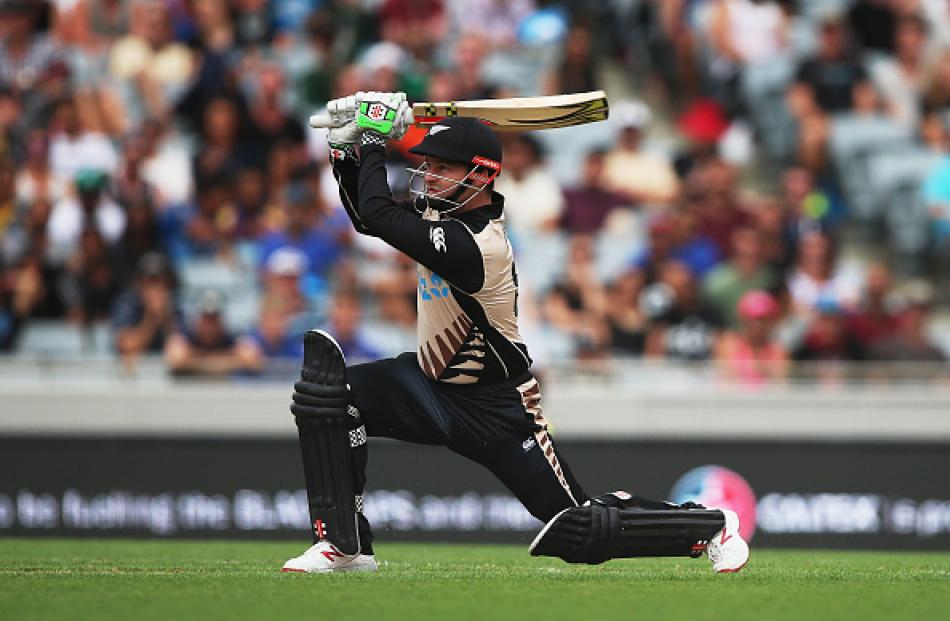 Colin Munro launches another big shot on his way to 50 off 14 balls. Photo Getty