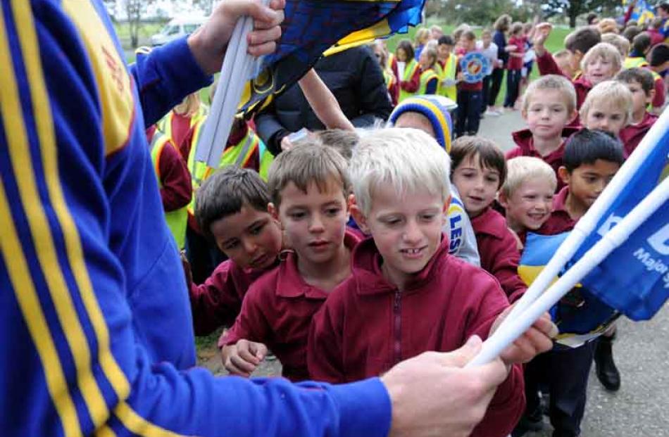 Collecting flags from Adam Thompson at Clutha Valley school are from front, Hamish Smith (7),...