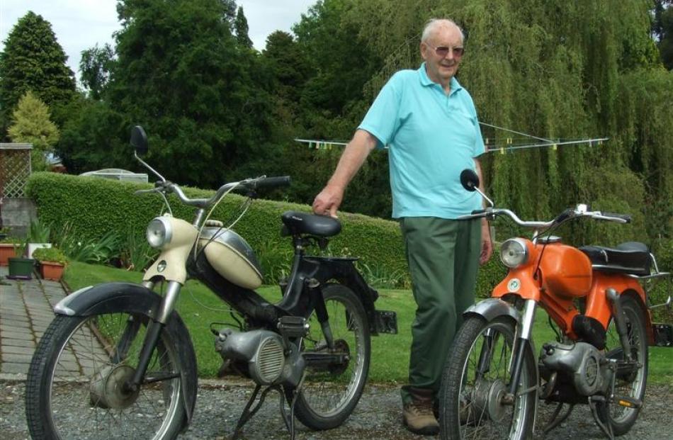 Collector Allan Budge with his two mopeds - a 1958 Puch (left) and a 1974 Puch. Photos by Helena...