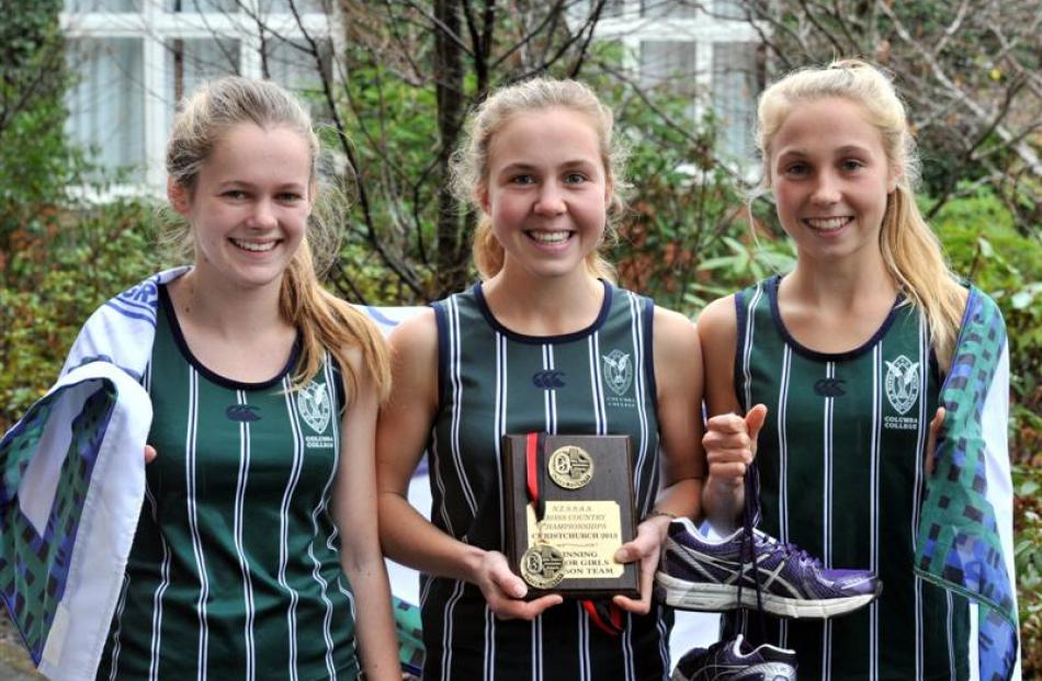 Columba College runners (from left) Charlotte Cahill, Sian English and Hanna English celebrate...