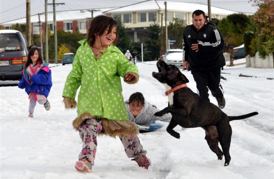 Coming down Wray St in Brockville in May are Tiana Tairi (4), Wairua Tairi-Hema-Rees (7), Maia...