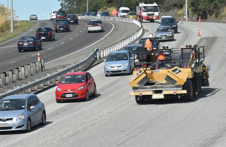 Contractors resurface the Southern Motorway at Saddle Hill. Photo by Gregor Richardson.