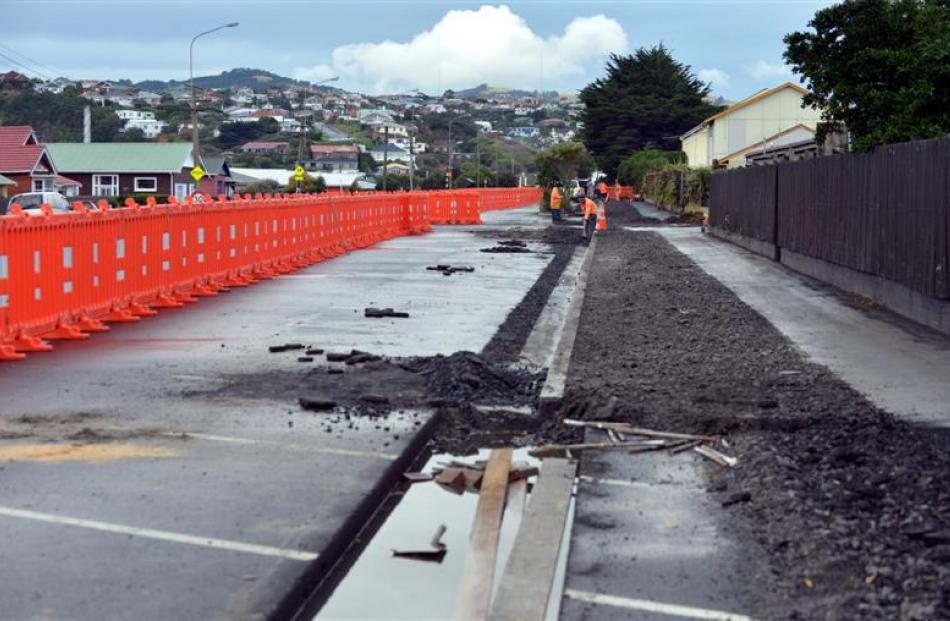 Contractors work on widening the footpath to create a shared path on Tahuna Rd. Photos by Peter...