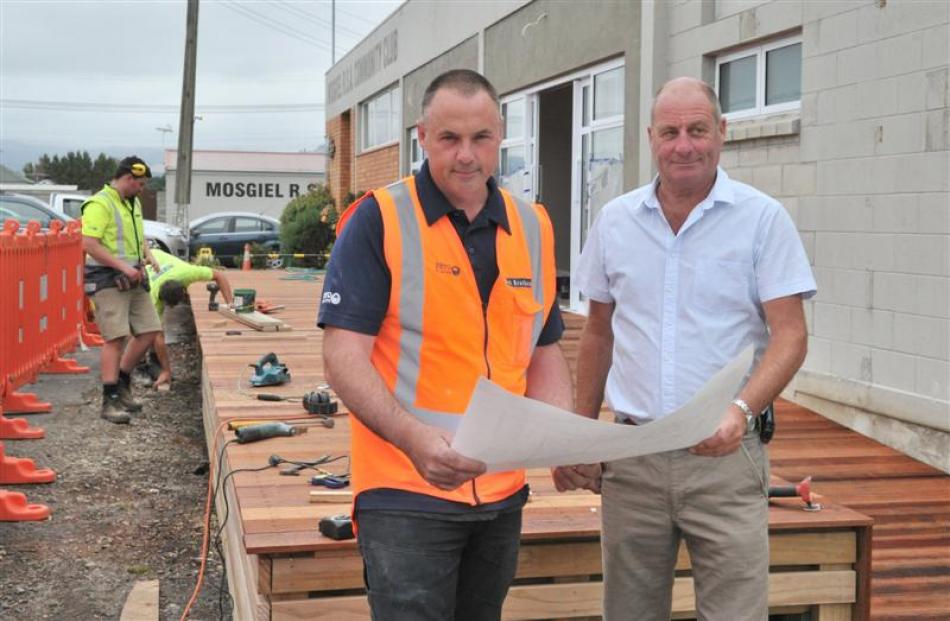 Cook Brothers Construction build team manager Craig Burr (left) and Mosgiel Memorial RSA vice...