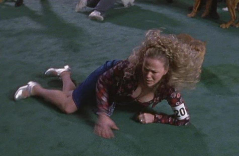 Cookie Fleck (Catherine O’Hara) is sabotaged, takes a tumble and wrecks her knee in the film Best...