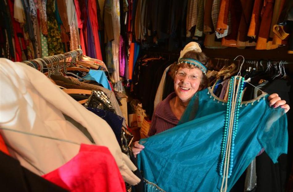 Costume mistress Margaret Jackson with some of the wares available for hire from the Taieri...