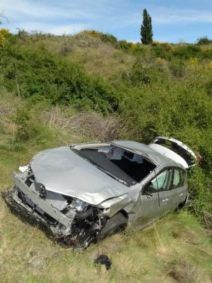 This rental car, driven by an Australian man, crashed down a steep bank below the Gibbston...