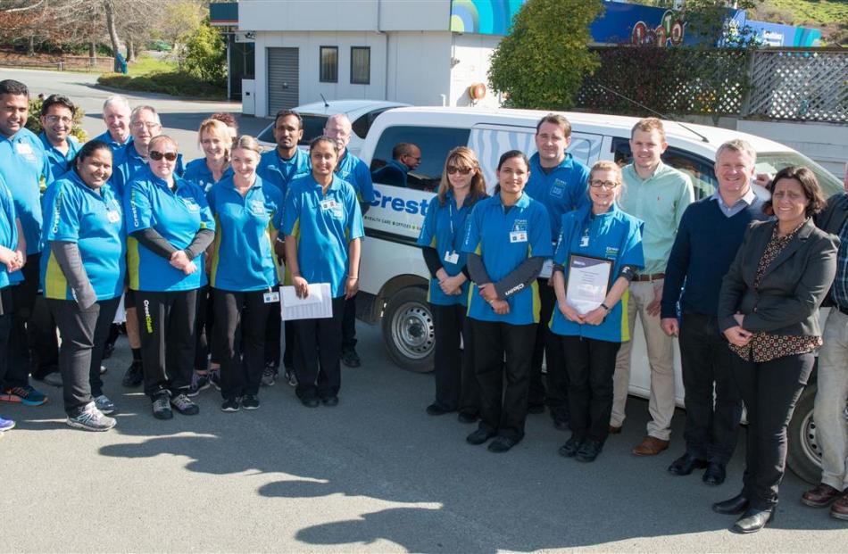 Crest Commercial Cleaning managing director Grant McLauchlan (third from right) and some of his...