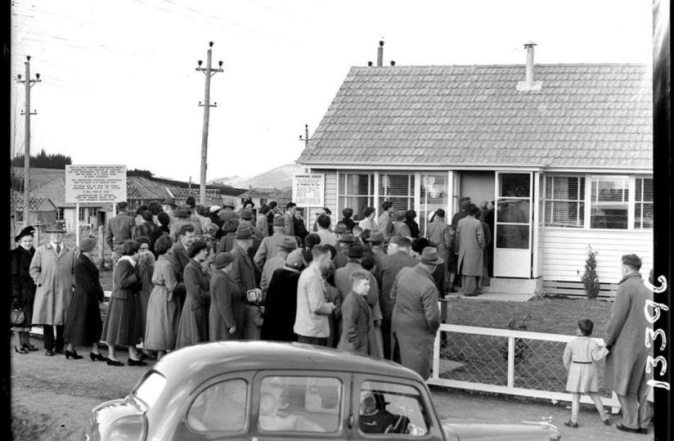 Crowds flock to inspect  a government ''Hammond'' house in Halfway Bush, part of a 1950s...