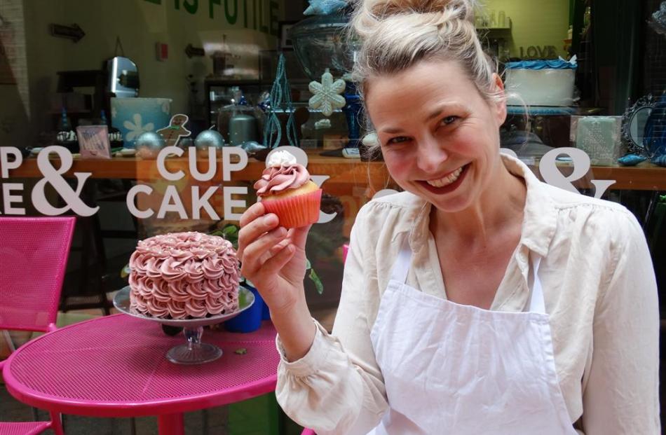 Cup & Cake owner Jaimie Stodler displays one of her creations at her Queenstown store. Photo by...