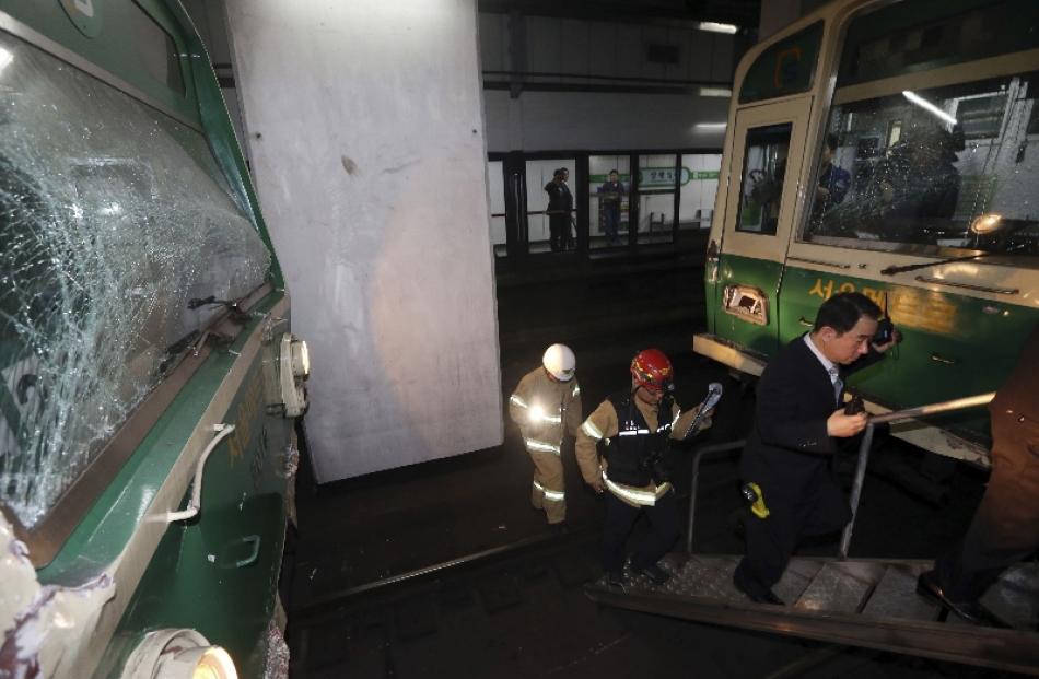 Damaged subway trains are seen at a subway station in Seoul. Photo by Reuters