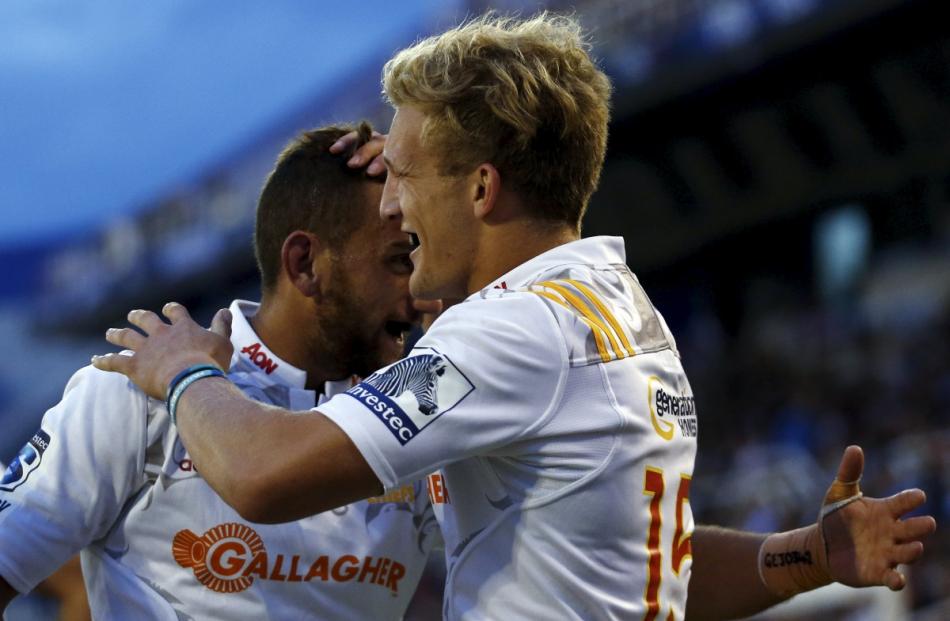 Damian McKenzie (right) of the Chiefs celebrates with Aaron Cruden after he scored a try. Photo...