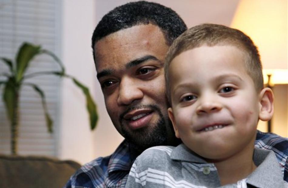Damon Brown sits with his son Julian, 5, at their home in Seattle. Damon found a kidney on...