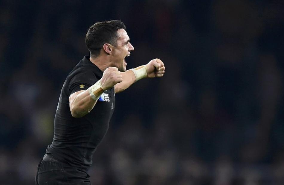Dan Carter celebrates after winning the Rugby World Cup. Photo: Reuters