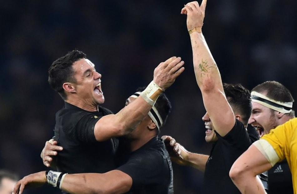 Dan Carter celebrates with teammates after the All Blacks beat the Wallabies to win the World Cup...