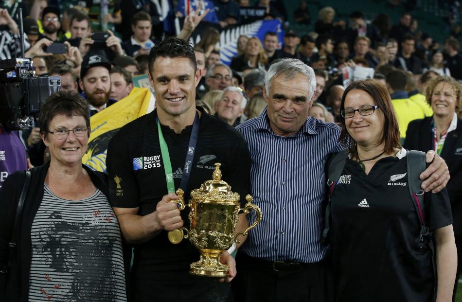 Dan Carter with his family after winning the Rugby World Cup. Photo: Reuters