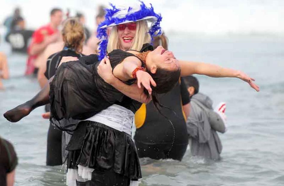 Daniel Bell (left) attempts to save Jodi-Lee Williams from the frigid waters of St Clair beach.