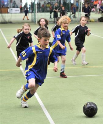 Daniel Blakely (6), of Arthur St School, runs for the ball in a futsal game at the Edgar Centre...