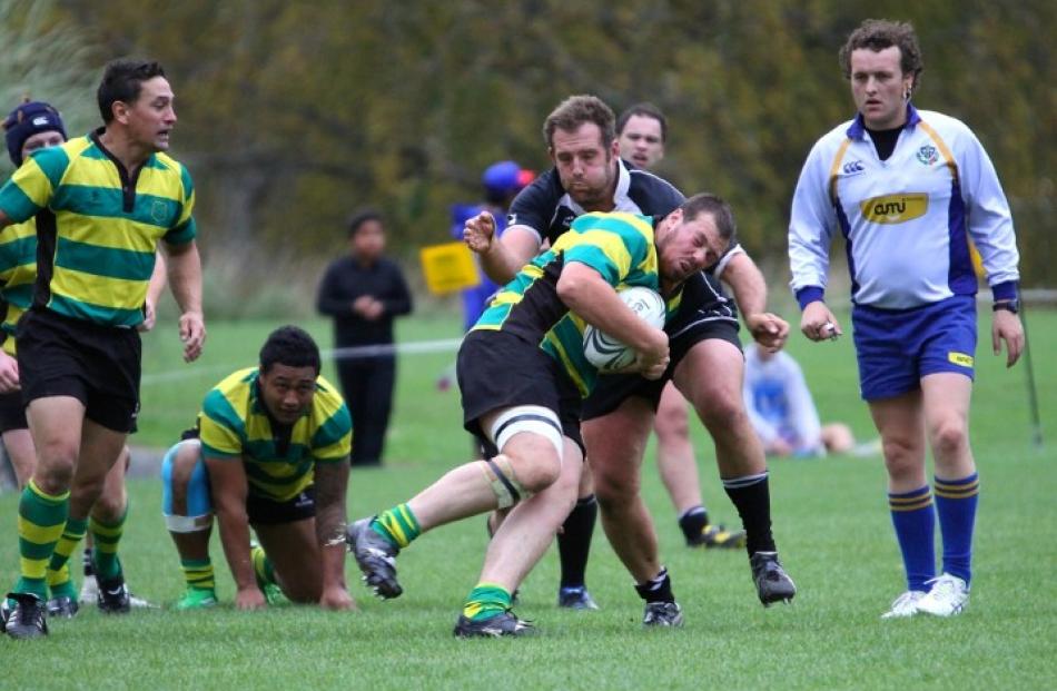 Daniel Johnson tackles Green Island prop Simon McCarthy.