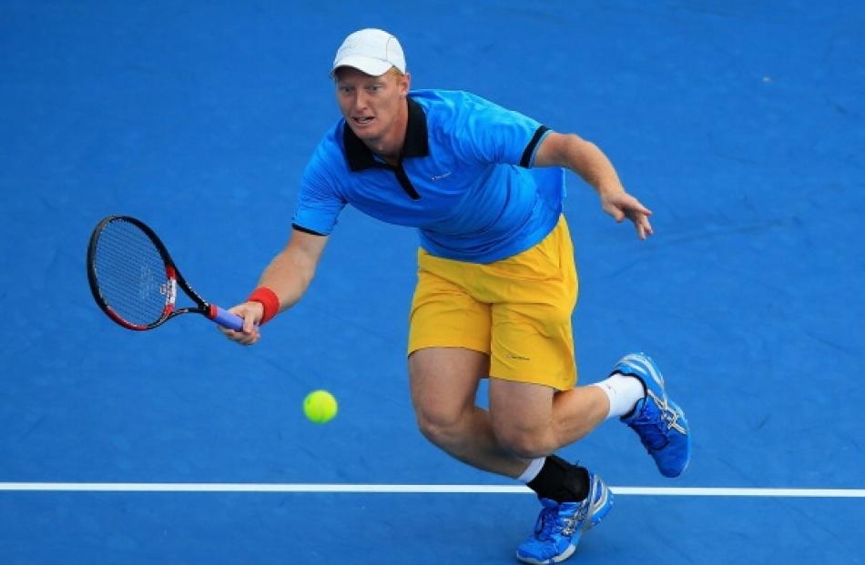 Daniel King-Turner of New Zealand plays a forehand in his first round match against Jesse Levine...