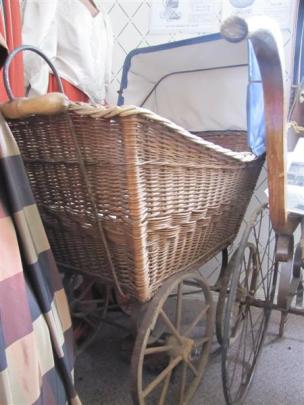 Dating from the early 1800s, this cane pram with wooden wheels is the oldest in the museum.