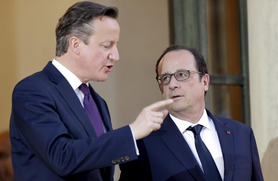 David Cameron, left, is meeting with European leaders including Francois Hollande. Photo: Reuters