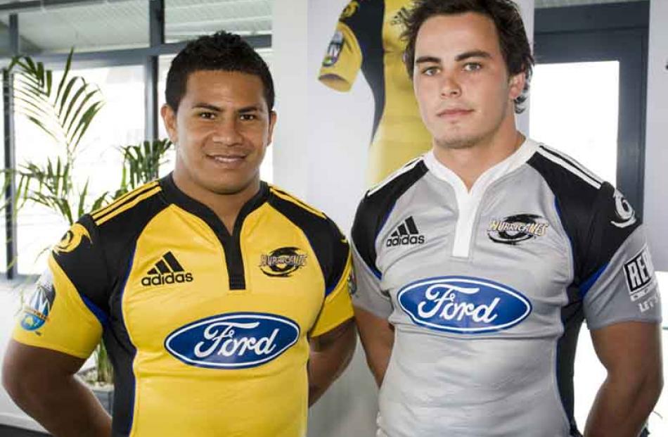 David Smith and Zac Guilford wear the new Super 14 Hurricanes home and away jerseys from sports...