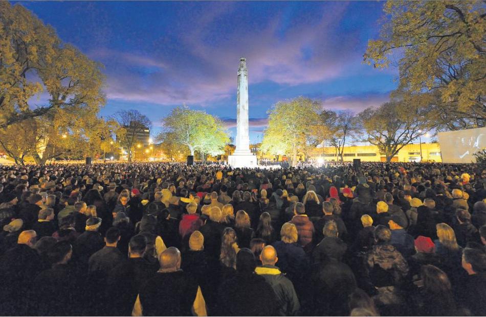 Dawn breaks over the cenotaph in Dunedin as a large crowd commemorates Anzac Day. Photo: Gerard O...