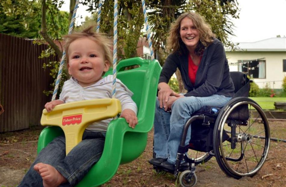 Debbie Henderson, who broke her back in a horse-racing accident, and 10-month-old son Will at...